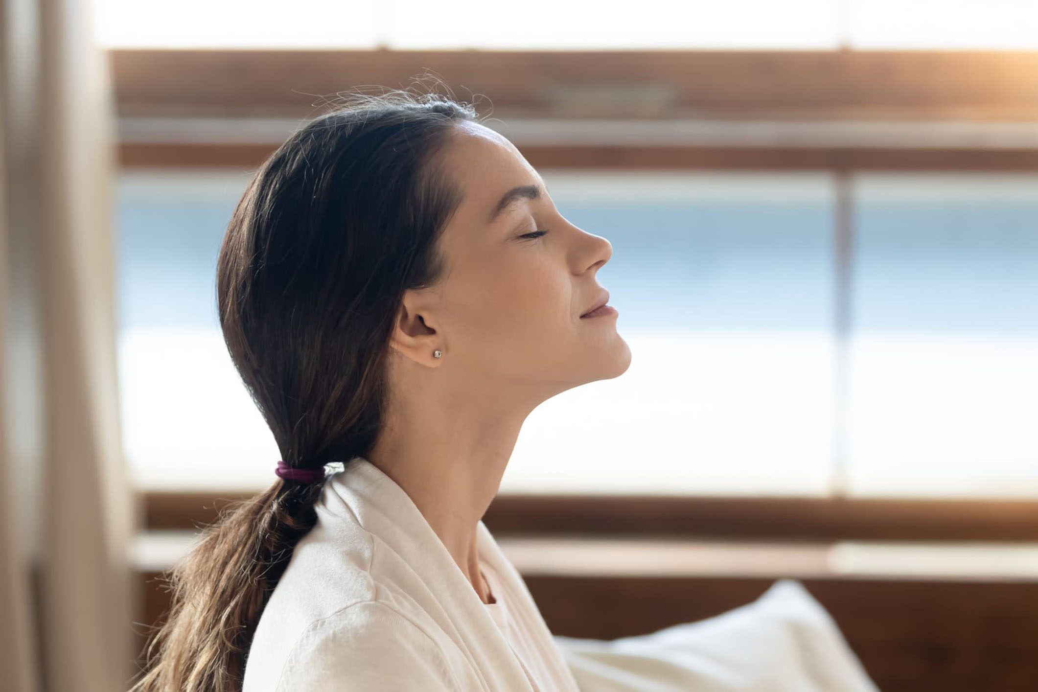 a woman breathing in fresh air