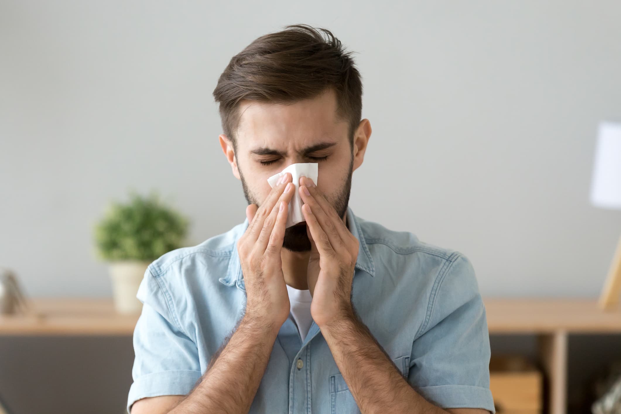 a man using a tissue